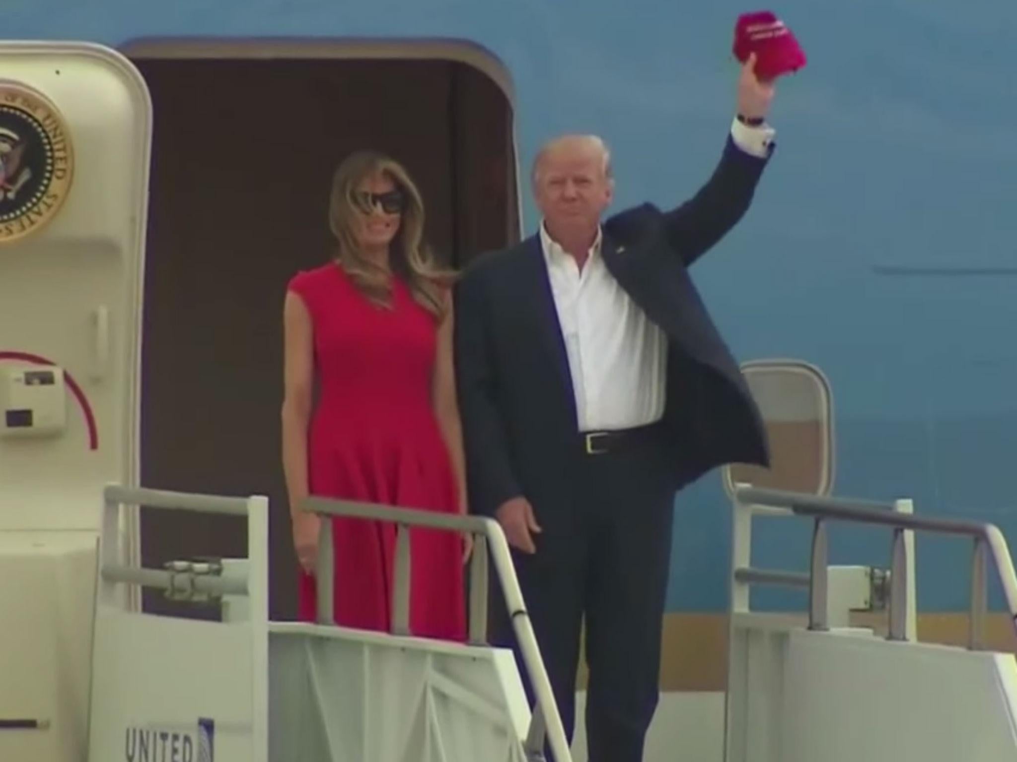 The President and First Lady emerge from the plane