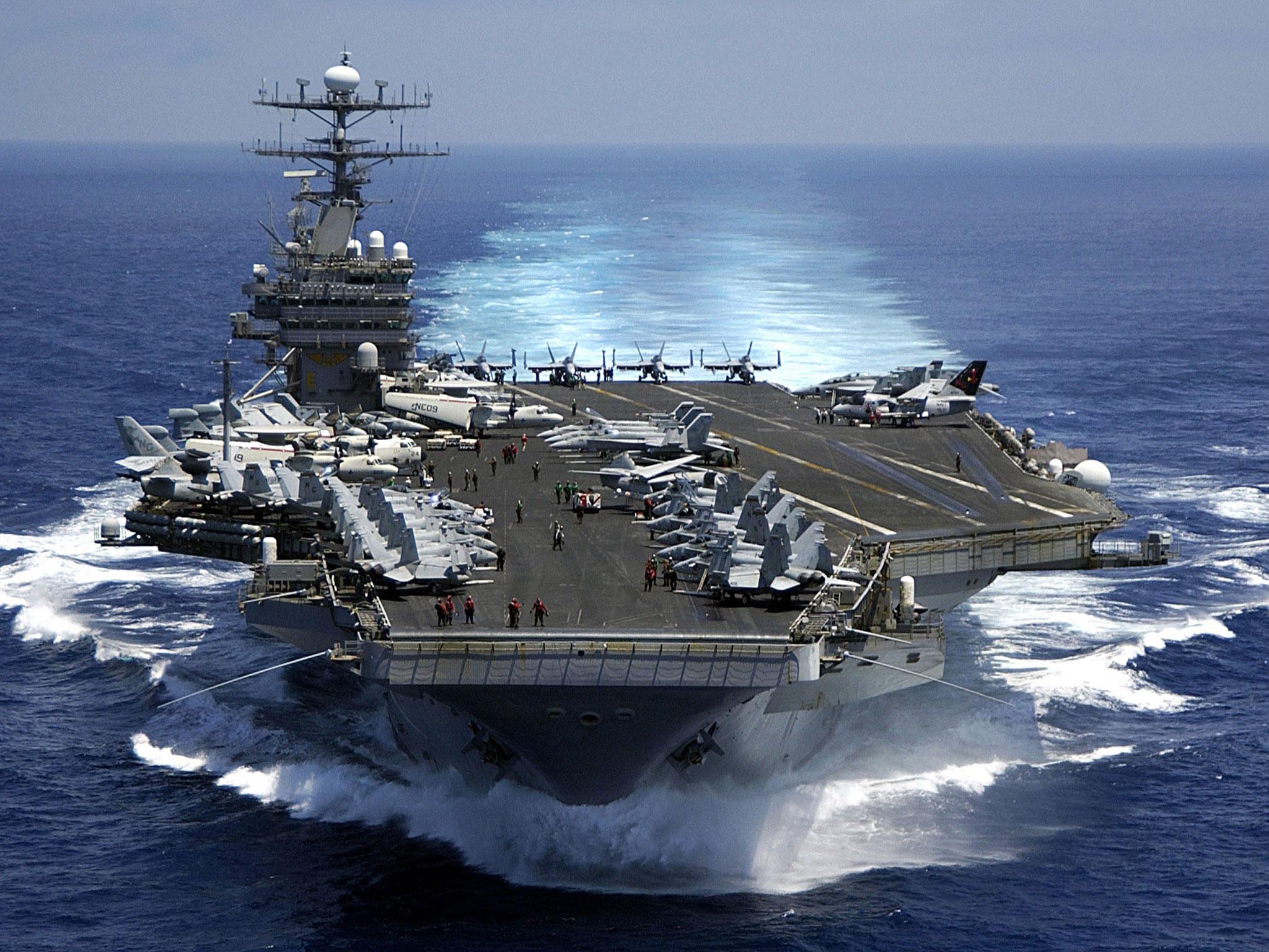 US Navy says the force, which includes the Nimitz-class aircraft carrier USS Carl Vinson and a fleet of supporting warships, has begun 'routine operations' in disputed waterway