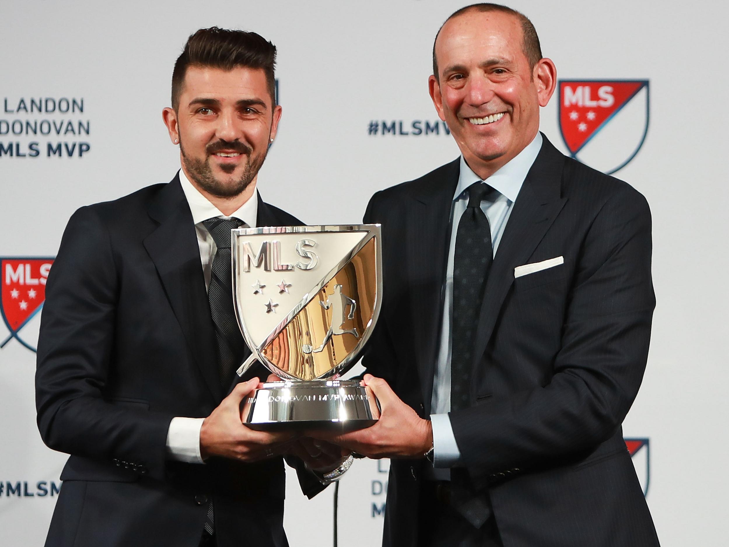 Garber (R) presents the 2016 MLS MVP trophy to David Villa