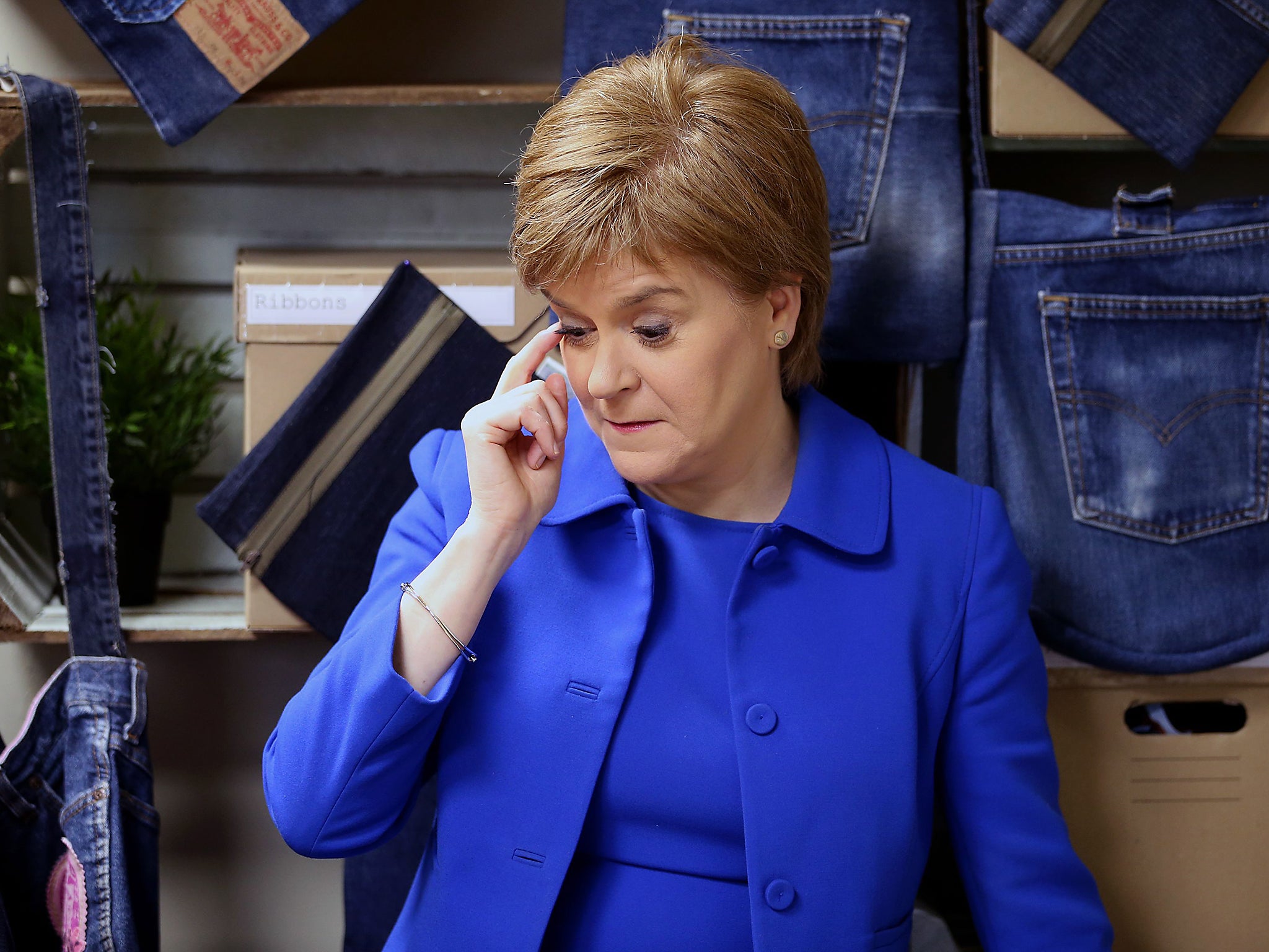 First Minister Nicola Sturgeon during a visit to R:evolve Clothing, an upcycling workshop in Rutherglen, before making an announcement on the Climate Challenge Fund