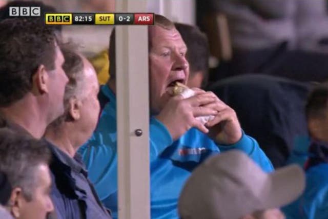 Sutton United goalkeeper Wayne Shaw eats a pie during the 2-0 FA Cup defeat by Arsenal