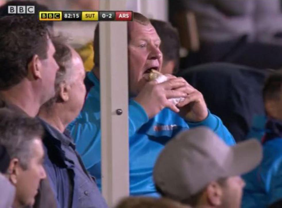 Sutton United goalkeeper Wayne Shaw eats a pie during the 2-0 FA Cup defeat by Arsenal
