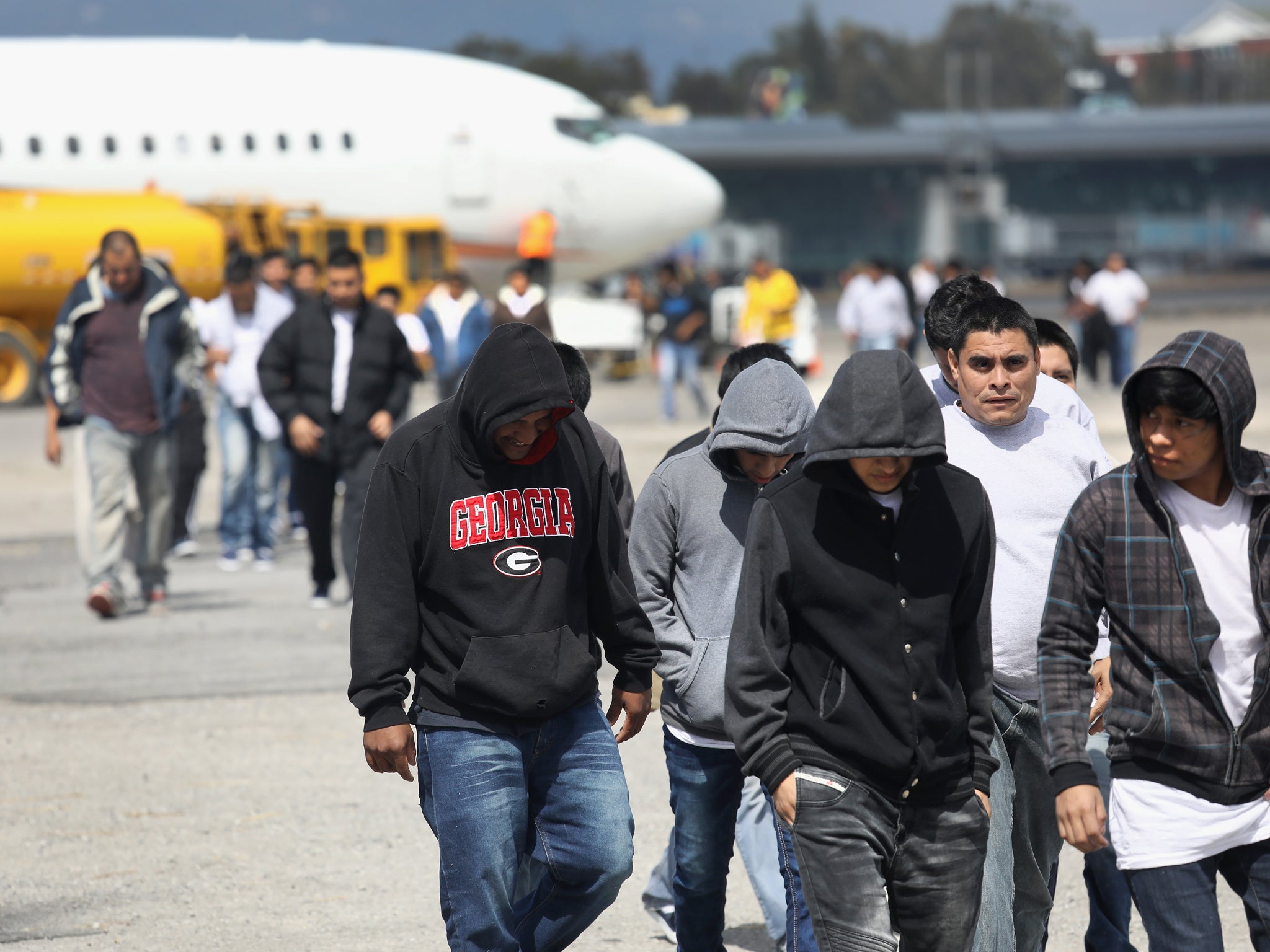 Guatemalan immigrants arrive in their home country after being deported from the US