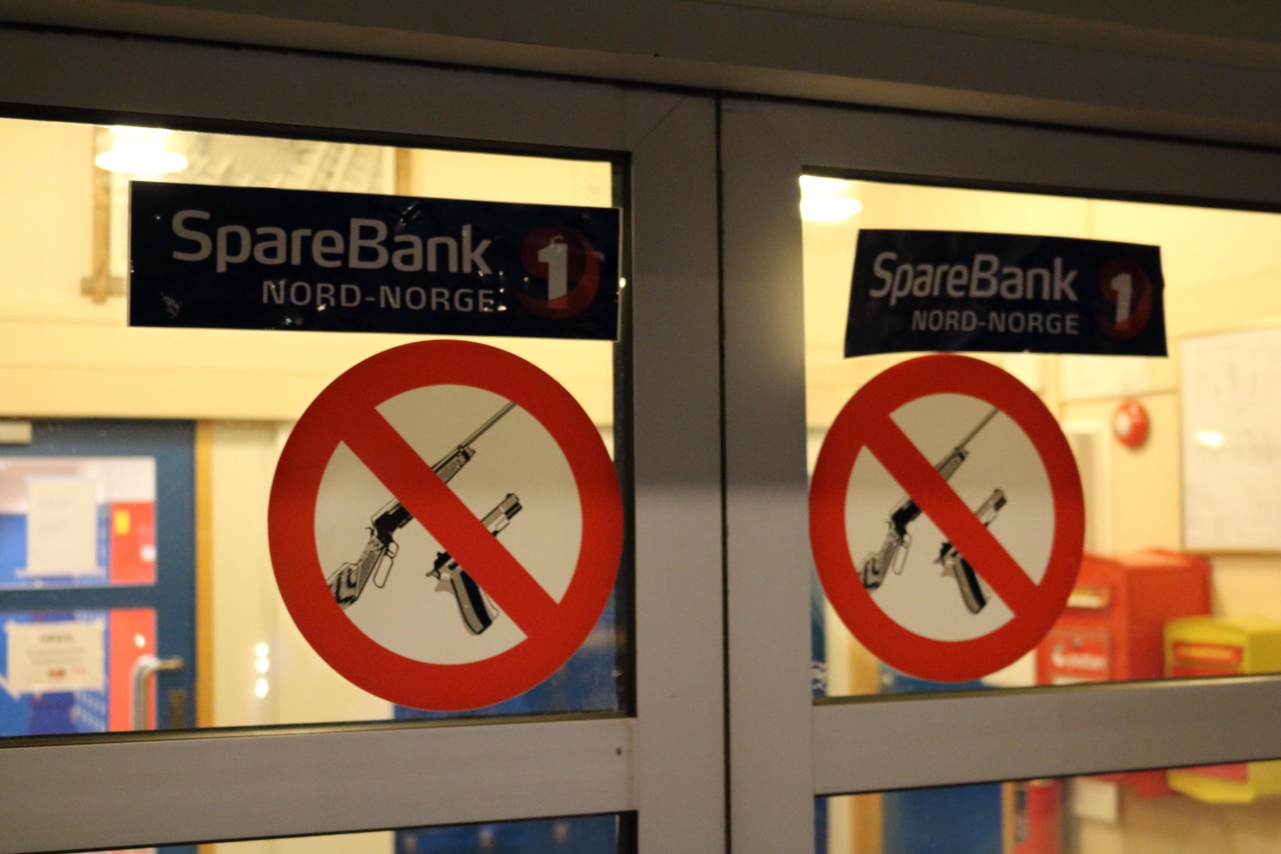 Signs prohibiting customers from carrying guns at the bank in Longyearbyen (George Godson)