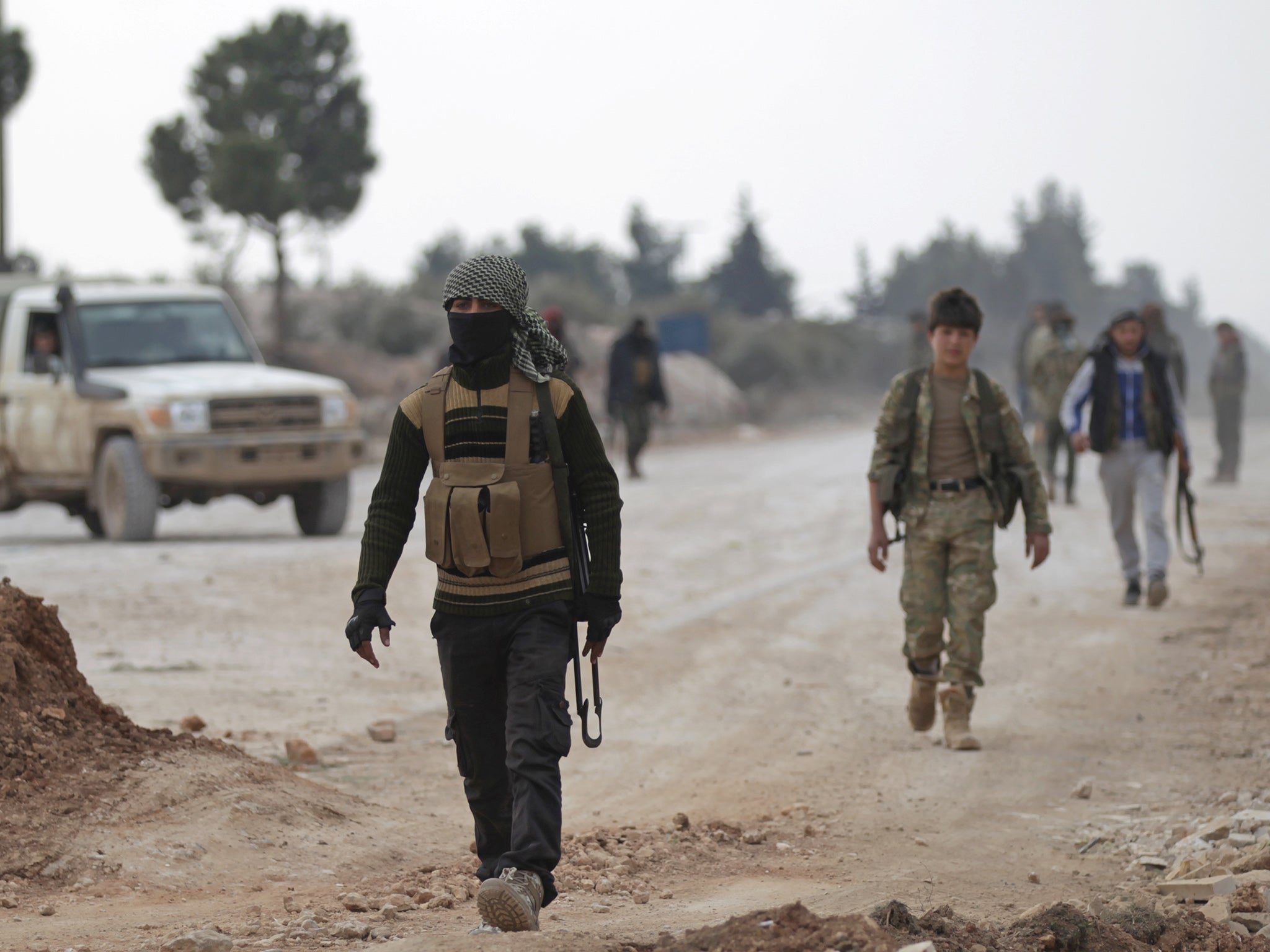 Free Syrian Army fighters on the outskirts of the Isis-controlled northern Syrian town of al-Bab