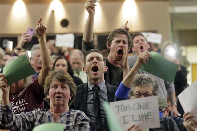 People shout at Representative Jason Chaffetz during his town hall meeting at Brighton High School on February 9, 2017 in Cottonwood Heights, Utah.