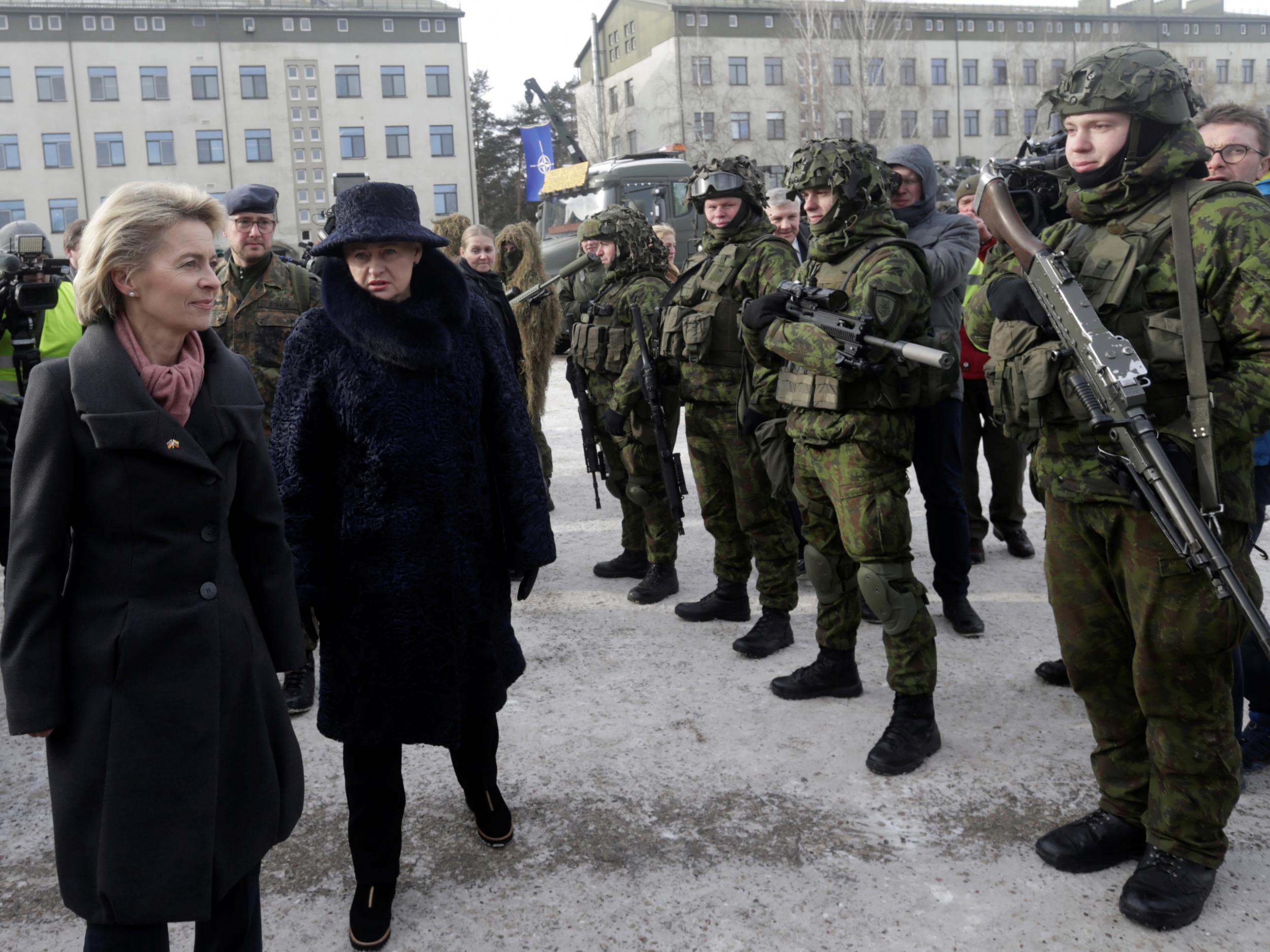 German Defence Minister Ursula von der Leyen and Lithuania's President Dalia Grybauskaite attend a ceremony to welcome the German battalion being deployed to Lithuania as part of Nato deterrence measures against Russia in Rukla on February 7 2017