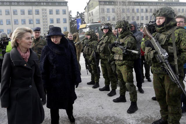 German Defence Minister Ursula von der Leyen and Lithuania's President Dalia Grybauskaite attend a ceremony to welcome the German battalion being deployed to Lithuania as part of Nato deterrence measures against Russia in Rukla on February 7 2017