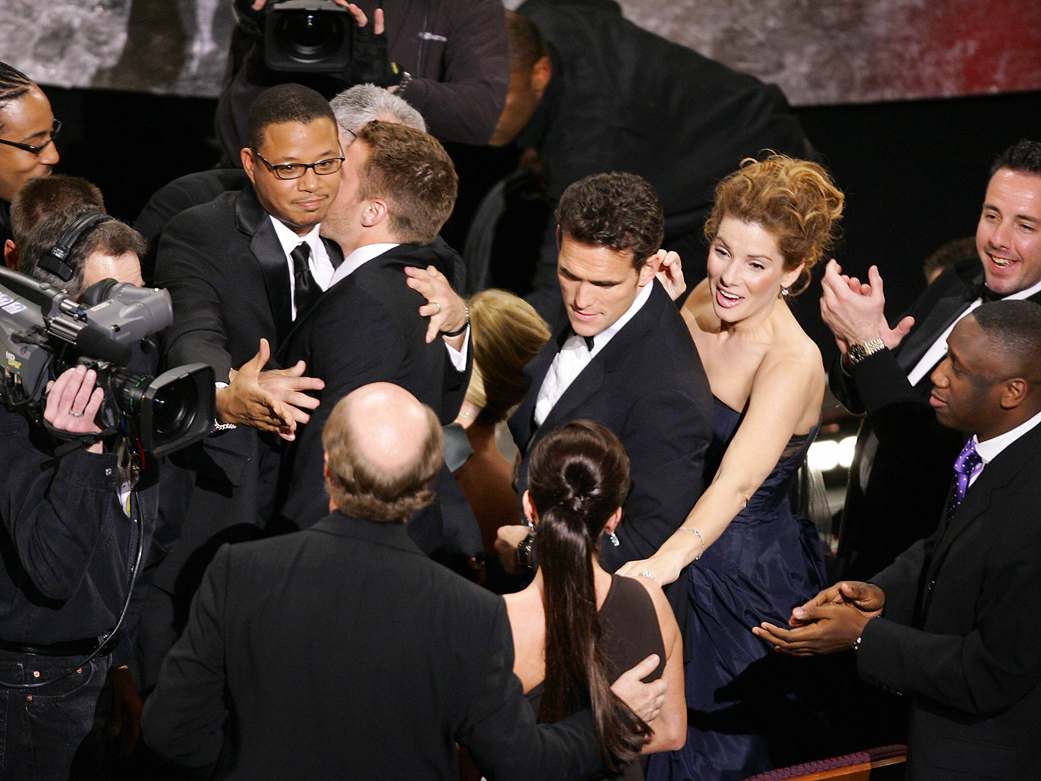 The cast of ‘Crash’, including Sandra Bullock, Matt Dillon and Terence Howard, celebrate after the movie won Best Picture in 2005 (Getty)