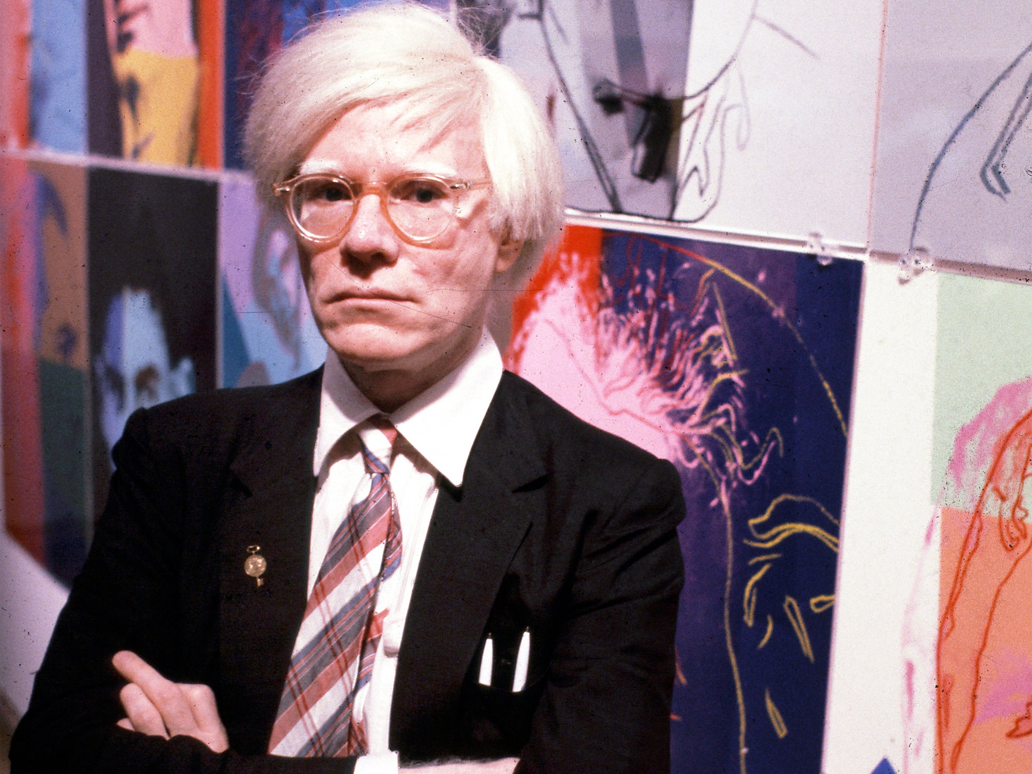 The American artist and filmmaker Andy Warhol with his paintings(1928 - 1987), December 15, 1980