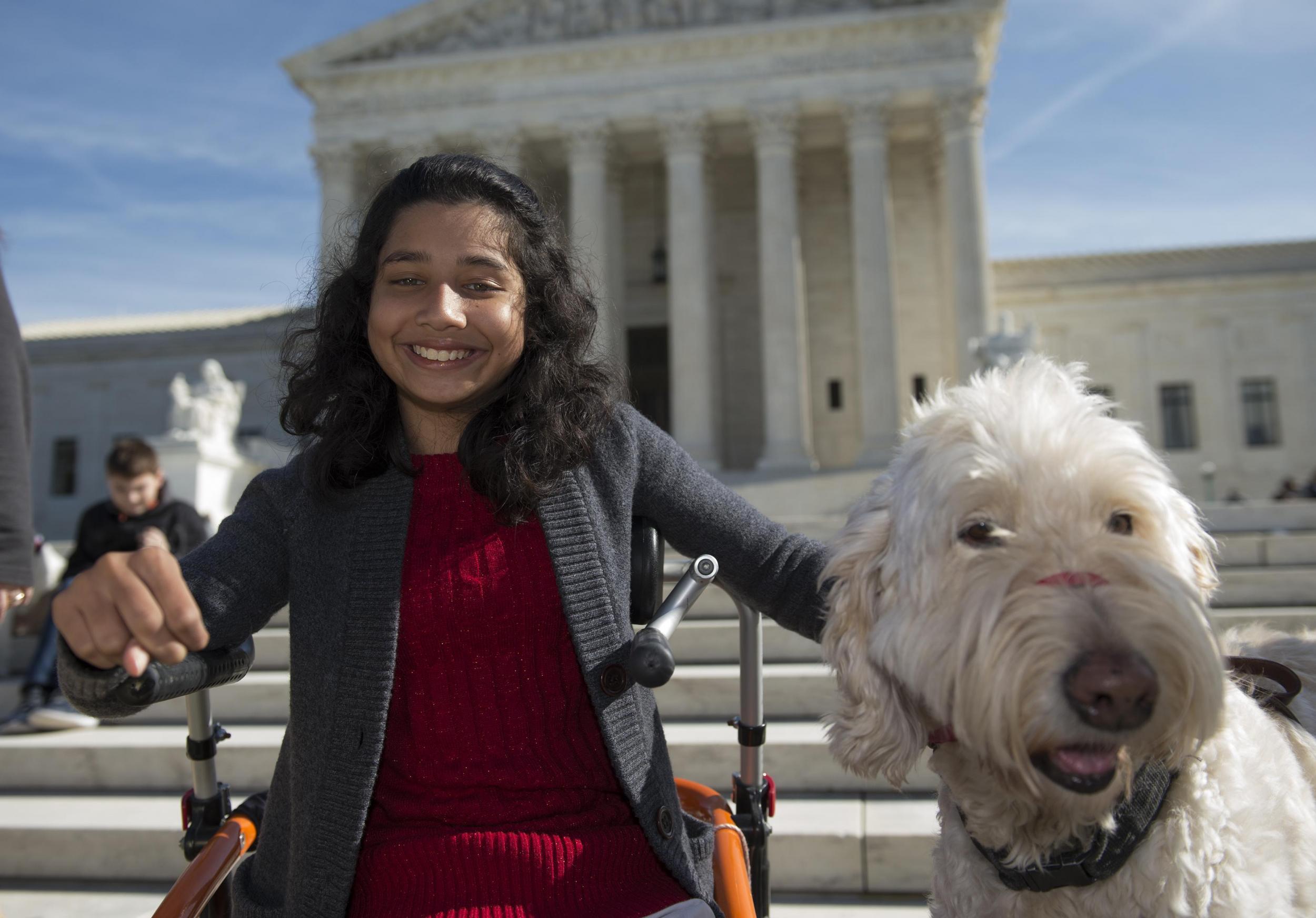 Ehlena Fry had to be taught at home after one school would not permit her service dog, Wonder