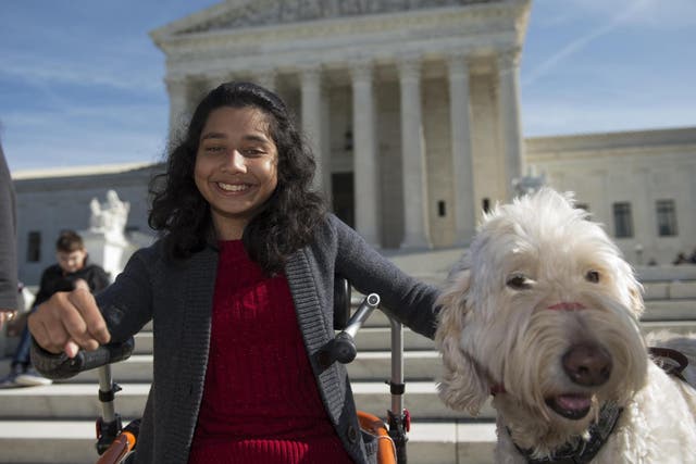Ehlena Fry had to be taught at home after one school would not permit her service dog, Wonder
