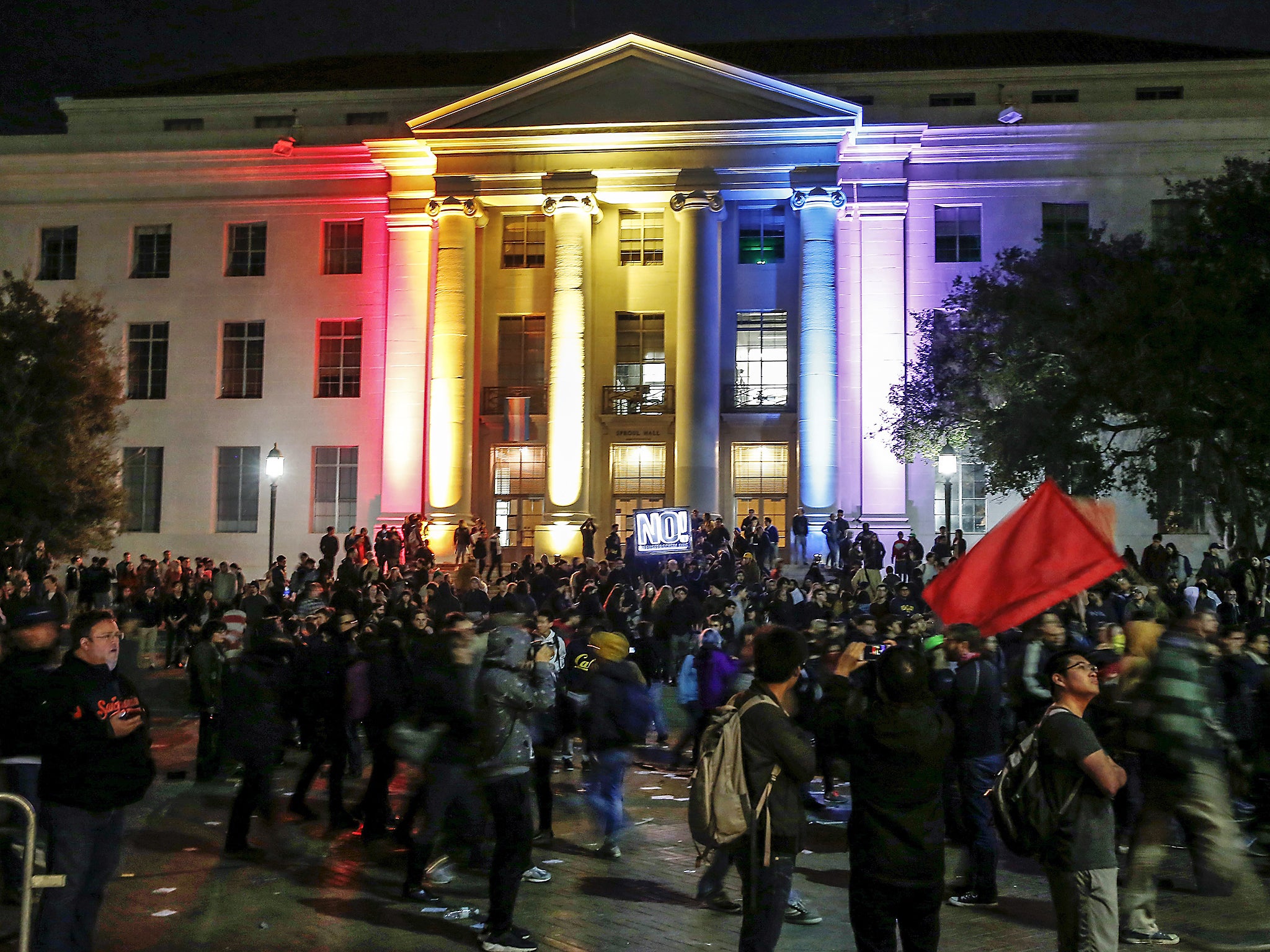 Berkeley students protest last month against a planned address by Yiannopoulos. When talk was then cancelled, Trump threatened to cut the university’s federal funding (Getty)