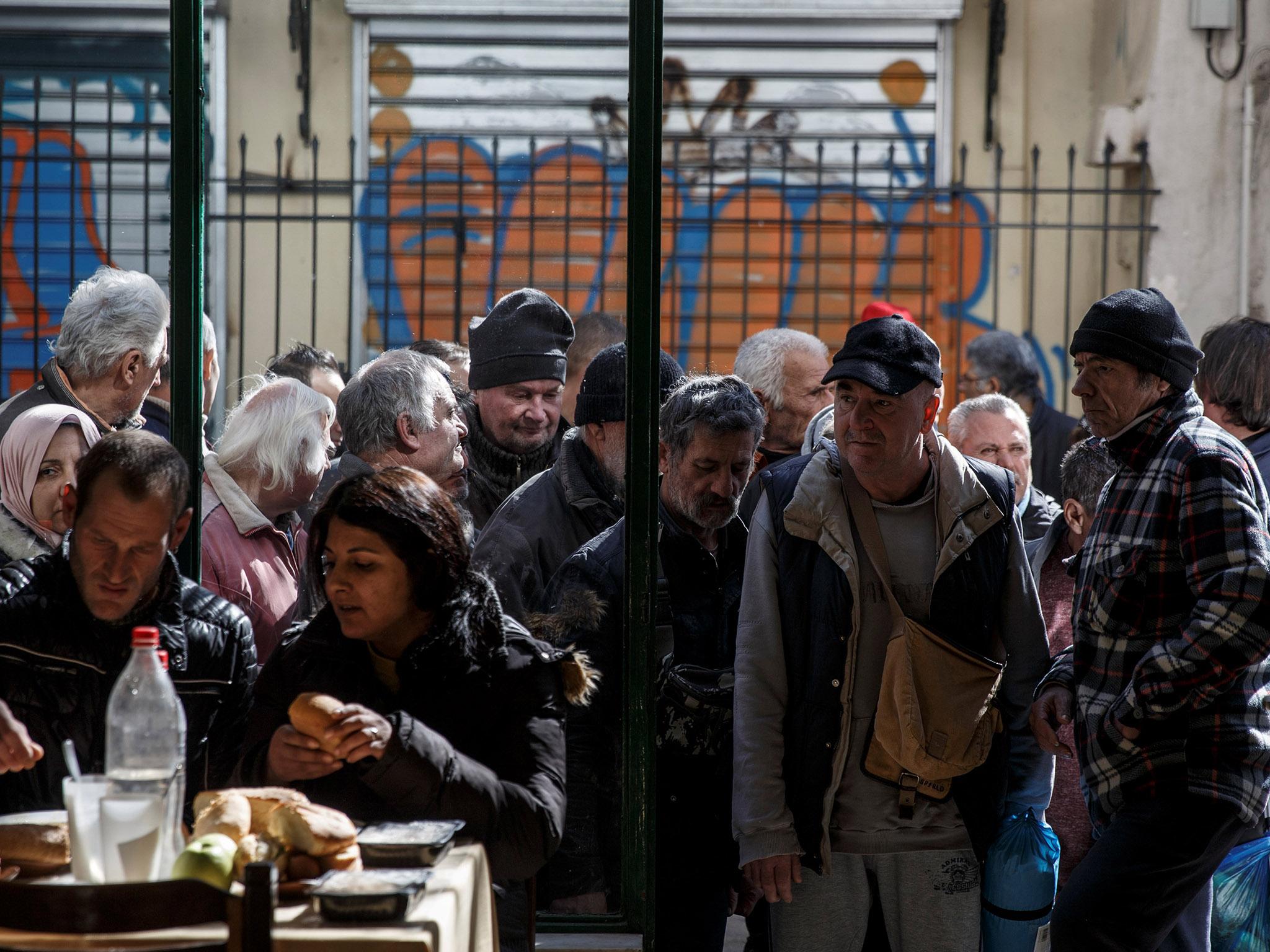 Many on relying on food handouts from soup kitchens like this one at an Orthodox church in Athens