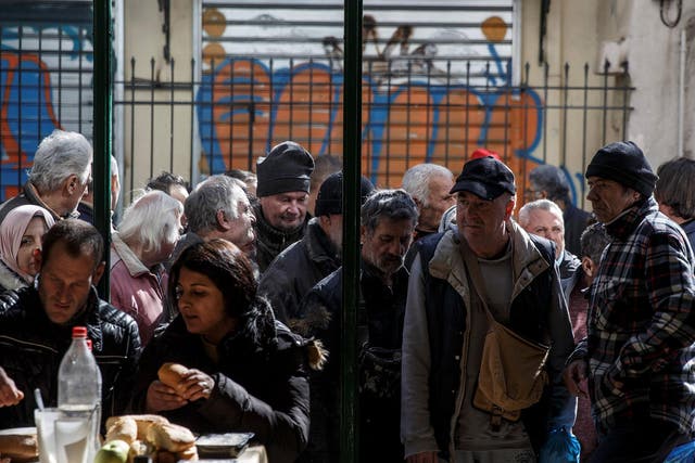 Many on relying on food handouts from soup kitchens like this one at an Orthodox church in Athens
