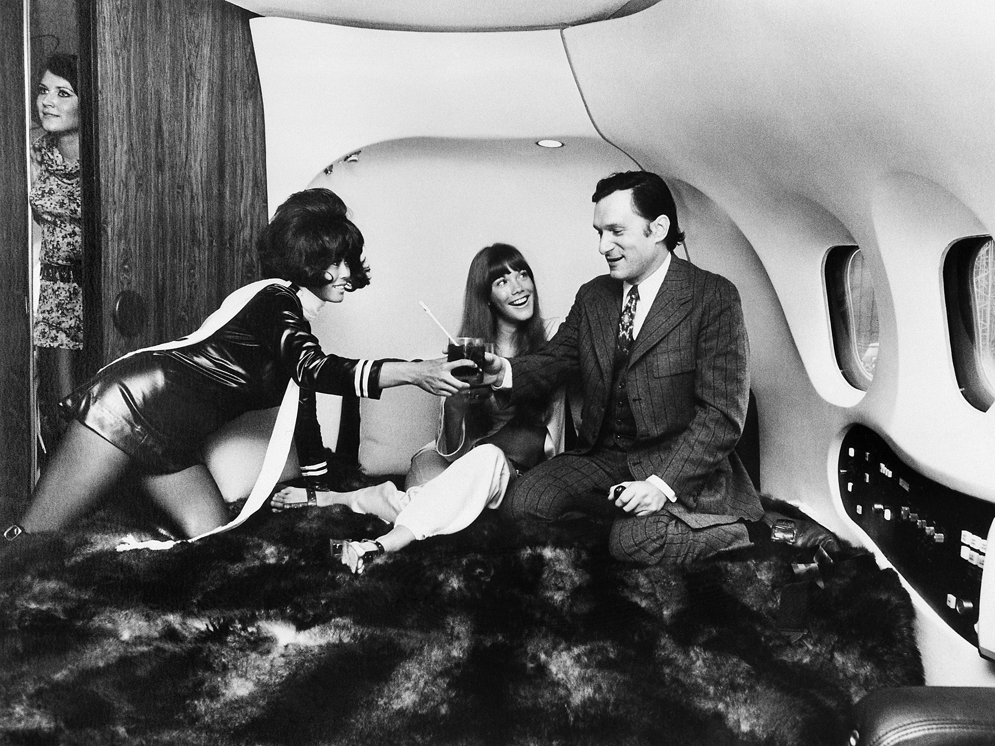 Mile high club: Hugh Hefner with his then girlfriend, actress Barbi Benton, and other playmates aboard the Playboy jet ‘Big Bunny’ in 1970