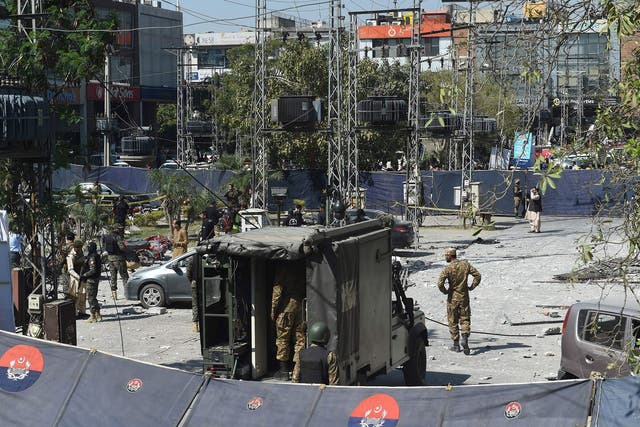 Pakistani security officials cordon off the site of a bomb attack in Lahore on February 23, 2017.