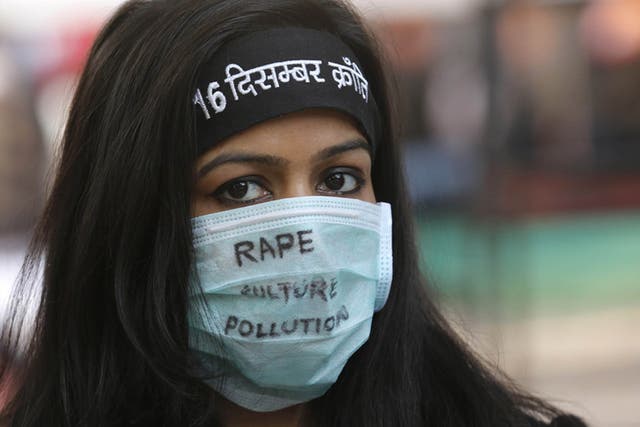 An activist takes part in a protest in December 2015 to mark the third anniversary of the Delhi bus gang rape