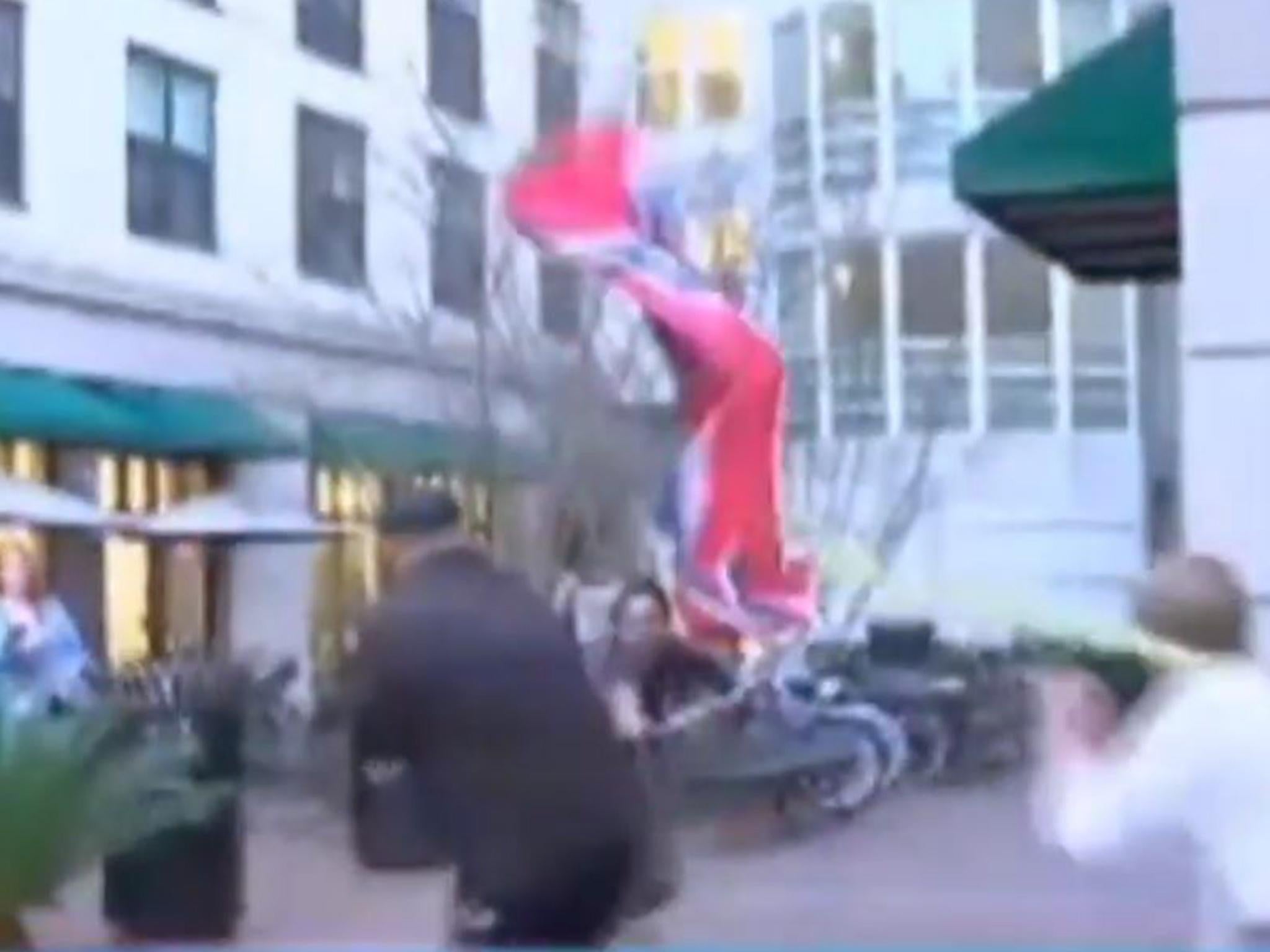 The two men tussle over the Confederate flag