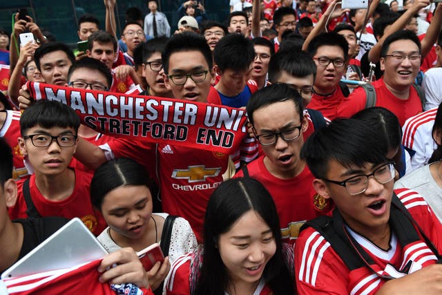 Manchester United fans in China wait for their heroes