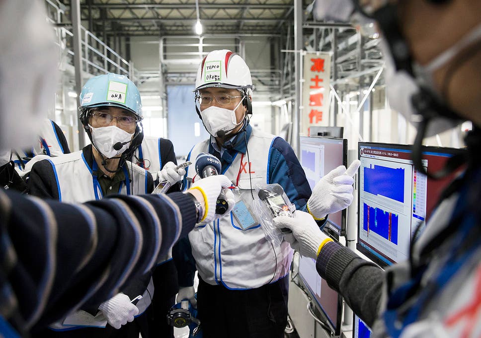 Workers of theTokyo Electric Power Co, which is tasked with the job to decommission the nuclear power plant in Okuma, Fukushima