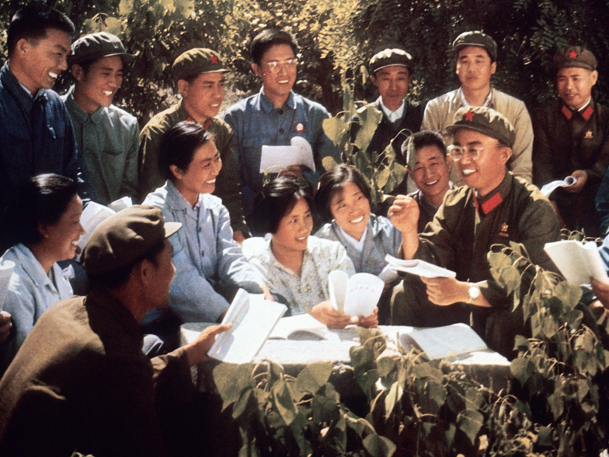 Chinese youth and red guards study copies of Mao’s ‘Little Red Book’ in a picture released in 1971 (Getty)