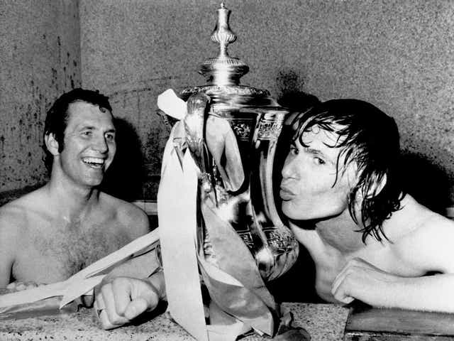 Stokes kissing the FA Cup as teammate Peter Osgood (L) looks on