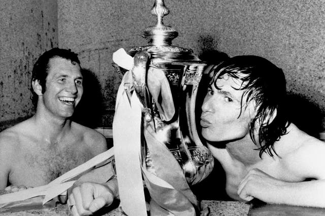 Stokes kissing the FA Cup as teammate Peter Osgood (L) looks on