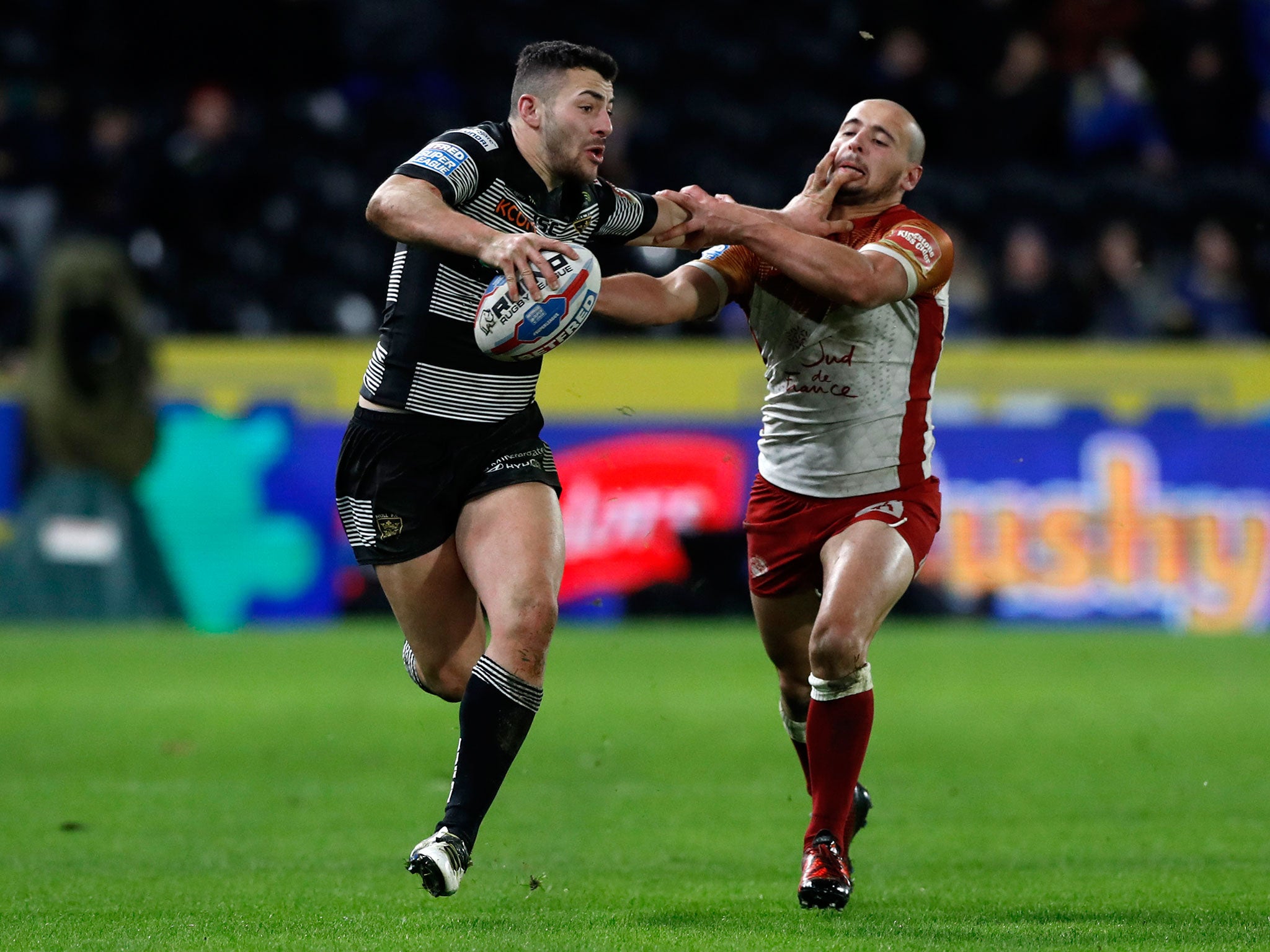 Hull FC's Chris Green and Catalans Dragons' Krisnan Inu during the Betfred Super League match at the KCOM Stadium