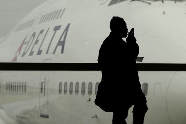 A Delta Air Lines flight that landed in New York was greeted by law enforcement officials who asked every passenger to show identification as they got off the plane. Here, a Delta airplane is shown in Detroit, in this file photo from 2012