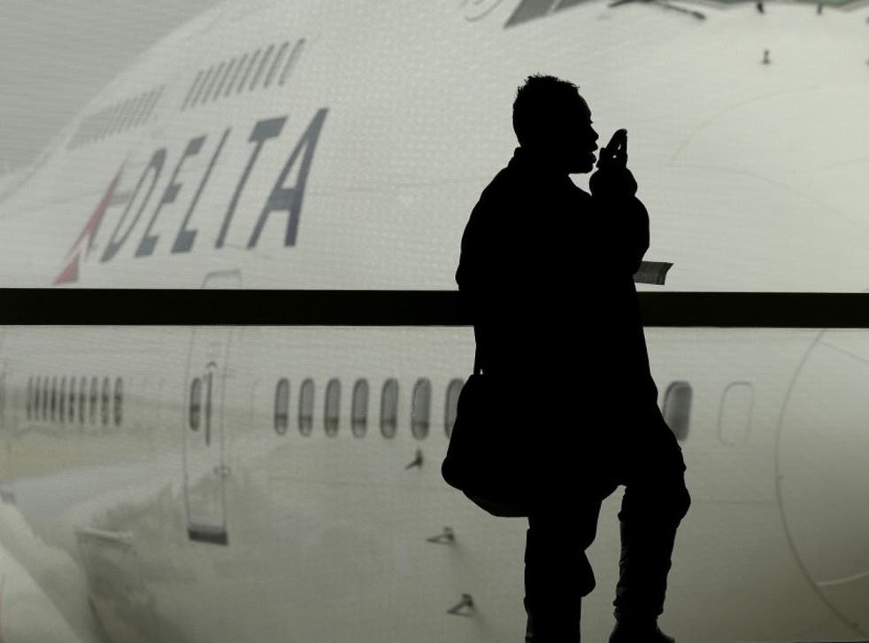 A Delta Air Lines flight that landed in New York was greeted by law enforcement officials who asked every passenger to show identification as they got off the plane. Here, a Delta airplane is shown in Detroit, in this file photo from 2012