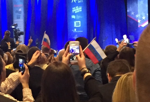 Supporters are seen waving Russian flags at CPAC conference