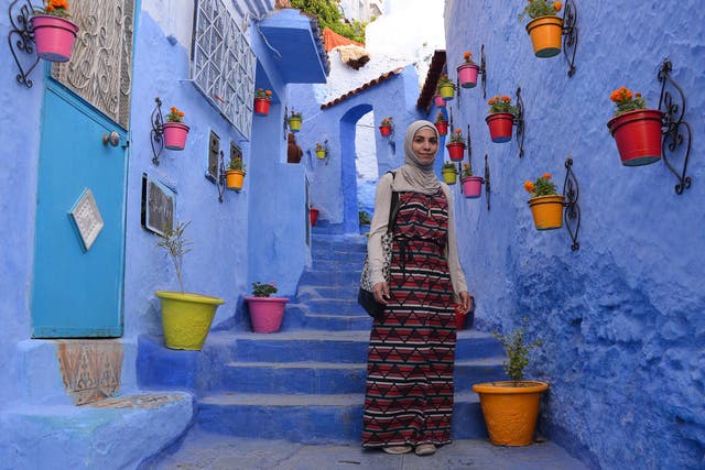 Esra Alhamal, pictured here in Morocco, has travelled to dozens of countries 