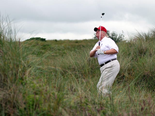 Donald Trump tees off at the The Trump International Golf Links Course in Balmedie, Scotland.  
