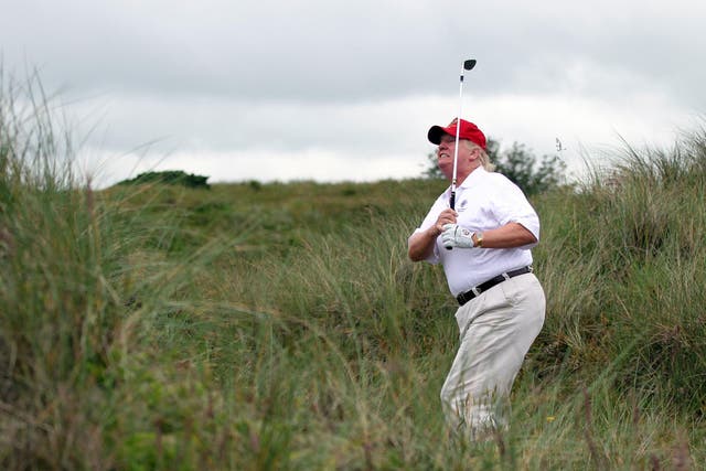 Donald Trump is known as being an avid golfer. Here, he tees off at the The Trump International Golf Links Course in Balmedie, Scotland.