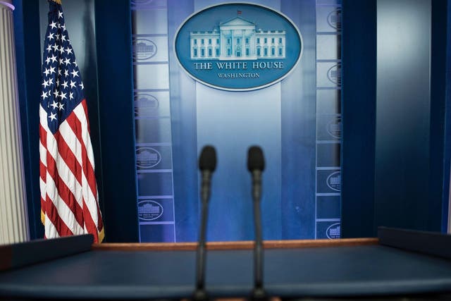An empty podium is seen as an off camera briefing is held with a group of reporters in Washington DC on February 24, 2017.