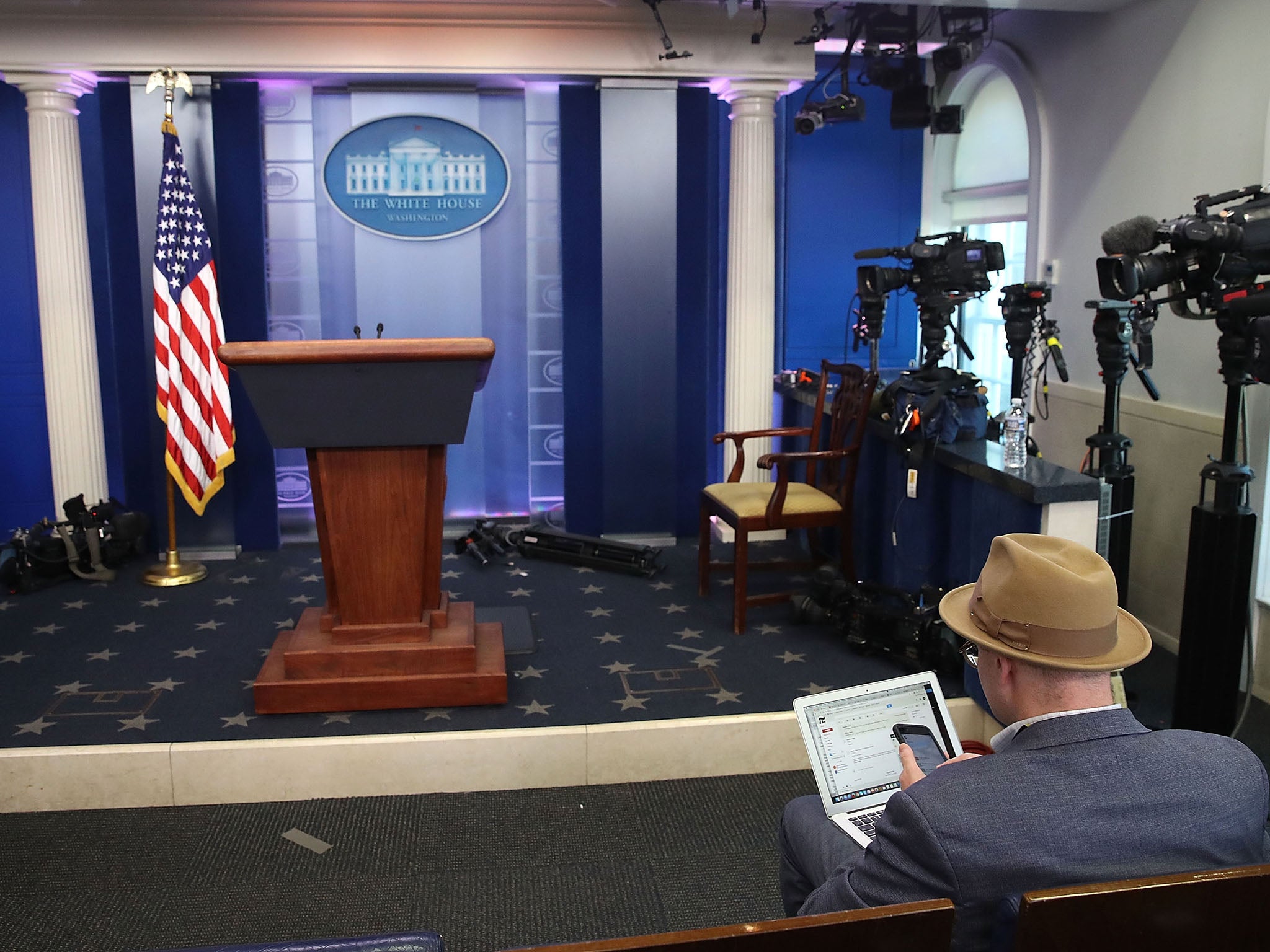 New York Times reporter Glenn Thrush works in the Brady Briefing Room after being excluded from a press gaggle by White House Press Secretary Sean Spicer, on 24 February