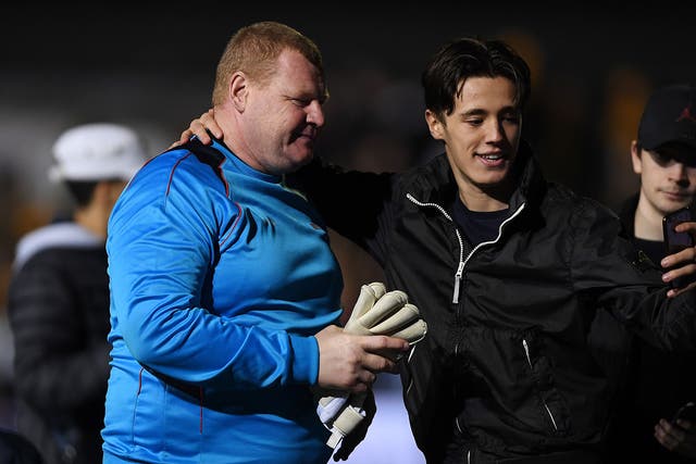 Wayne Shaw with a fan after Sutton's 2-0 defeat by Arsenal on Monday night