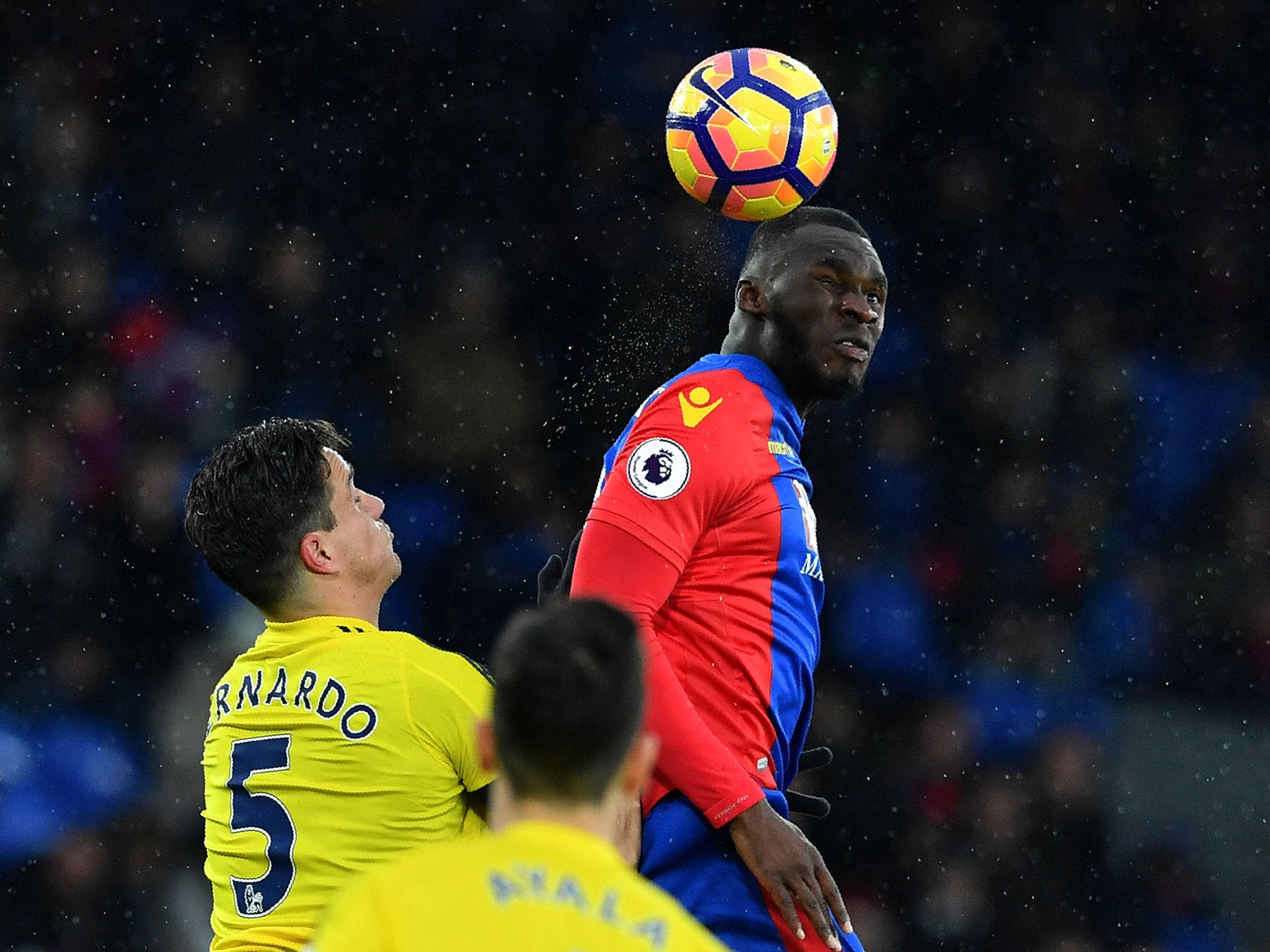 Benteke rise above Bernardo Espinosa to head the ball