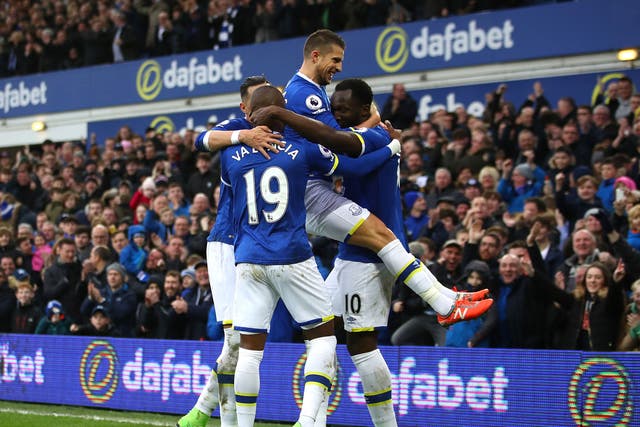 Everton's players celebrate with Lukaku after his goal secured victory for the home side