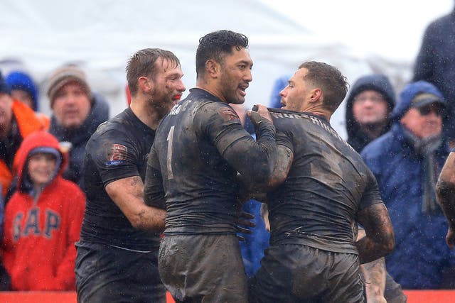 Toronto Wolfpack's Craig Worthington celebrates with team-mate Quentin Laulu Tugagae after scoring a try