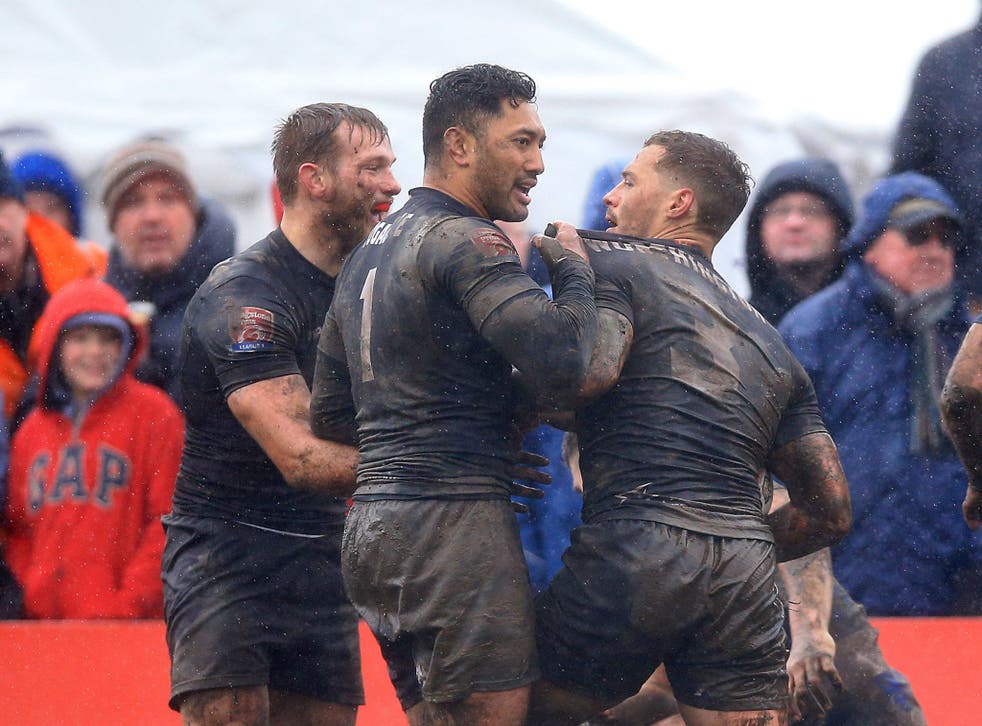 Toronto Wolfpack's Craig Worthington celebrates with team-mate Quentin Laulu Tugagae after scoring a try