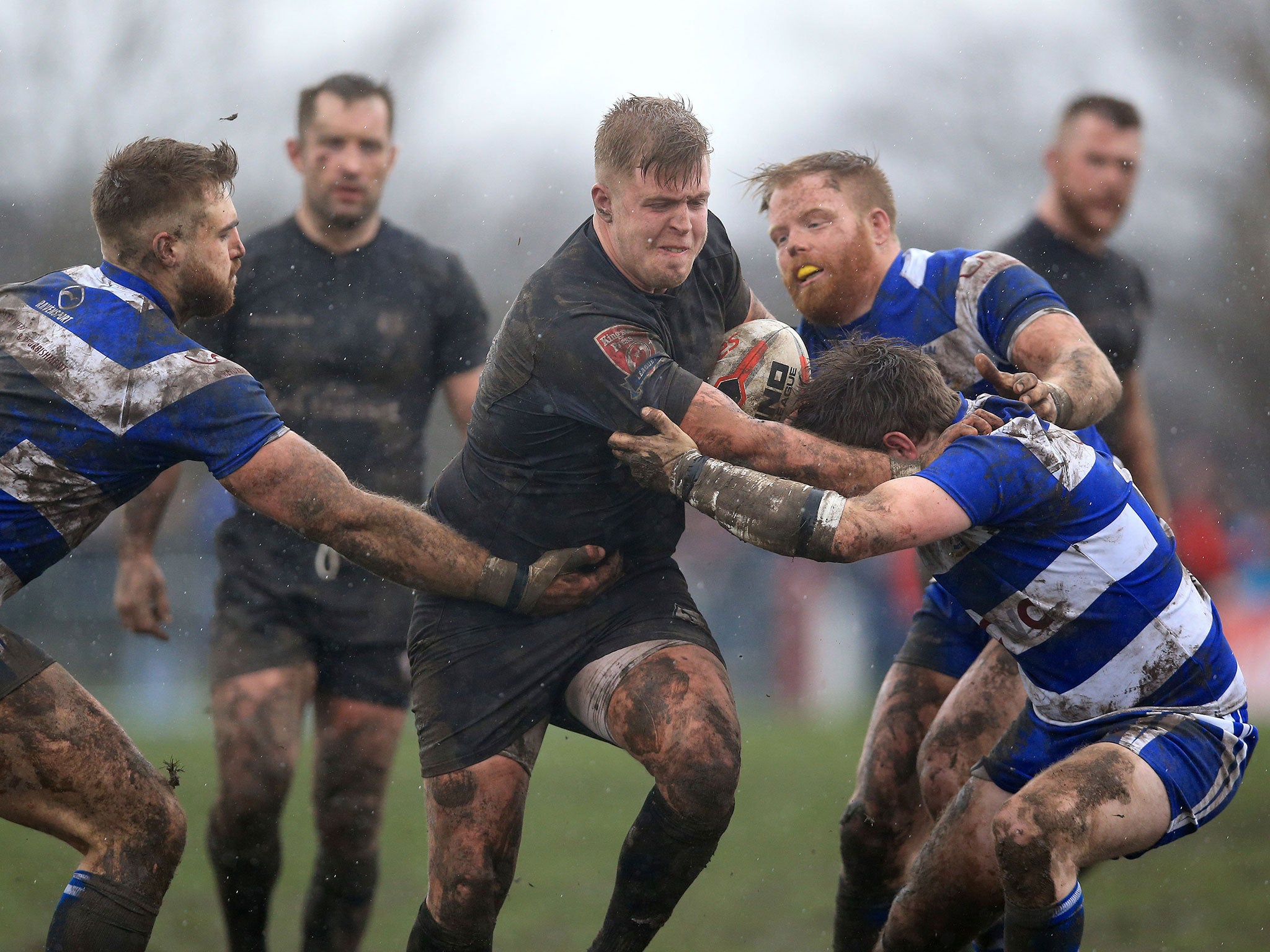 &#13;
Siddal's Joe Martin tackles Toronto Wolfpack's Jack Bussey (PA)&#13;