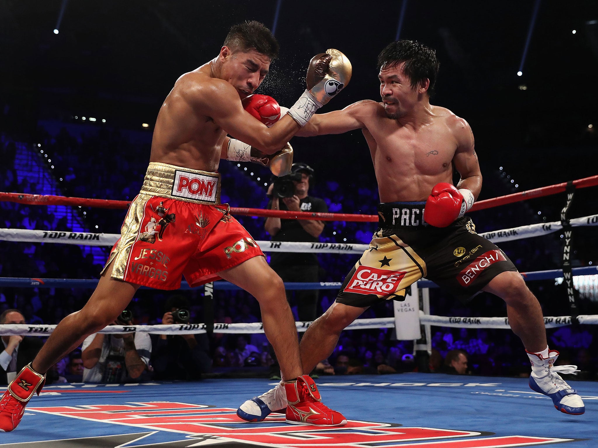 Manny Pacquiao in the ring against Jessie Vargas