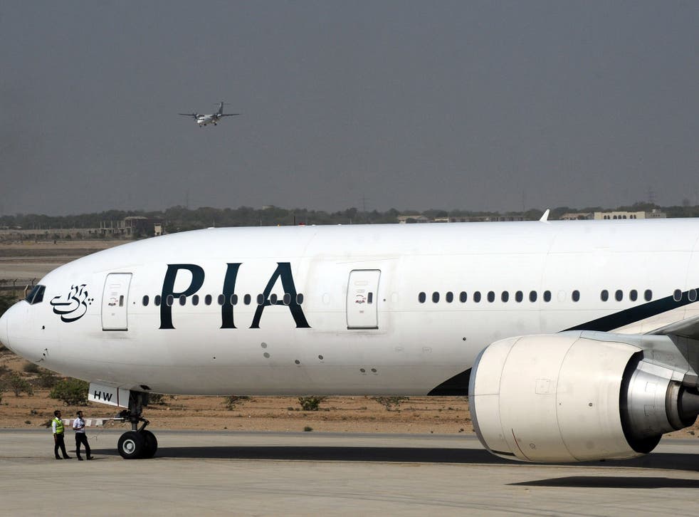 Pakistan International Airlines (PIA) plane taxies before take-off from Karachi International Airport in Karachi