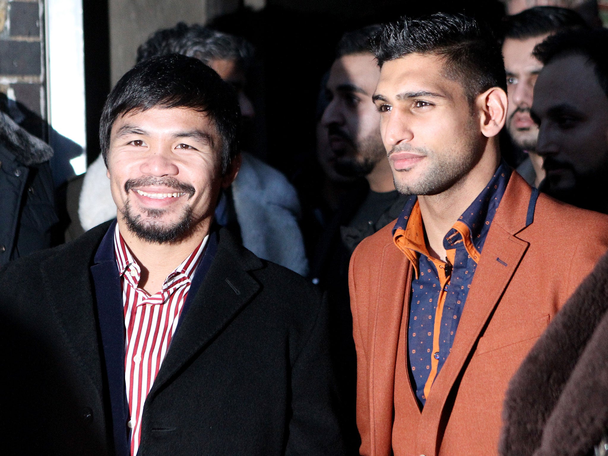 Pacquiao and Khan pose after holding discussions about the possibility of a future fight, at Fitzroy Lodge Amateur Boxing Club on January 23, 2015