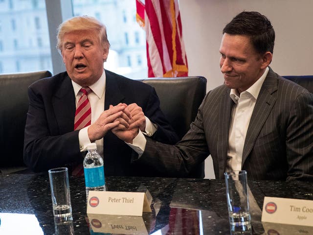 Donald Trump shakes hands with Peter Thiel during first major meeting with technology leaders