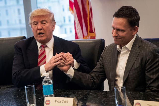 Donald Trump shakes hands with Peter Thiel during first major meeting with technology leaders