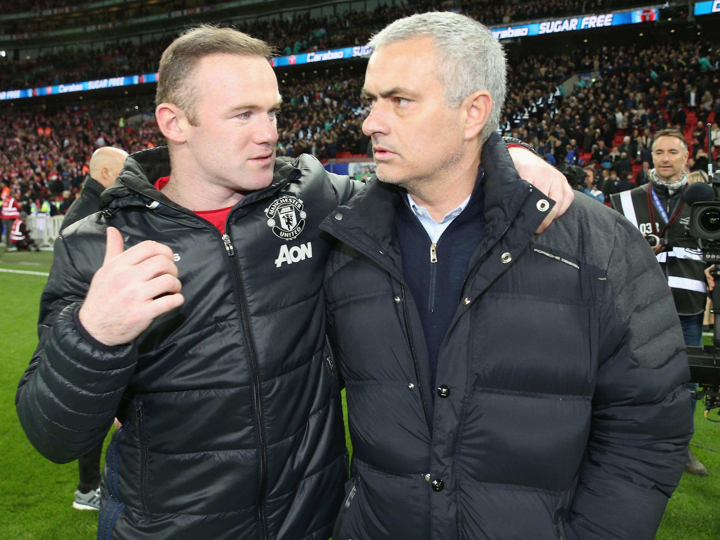 Mourinho and his captain Wayne Rooney celebrate their cup final win