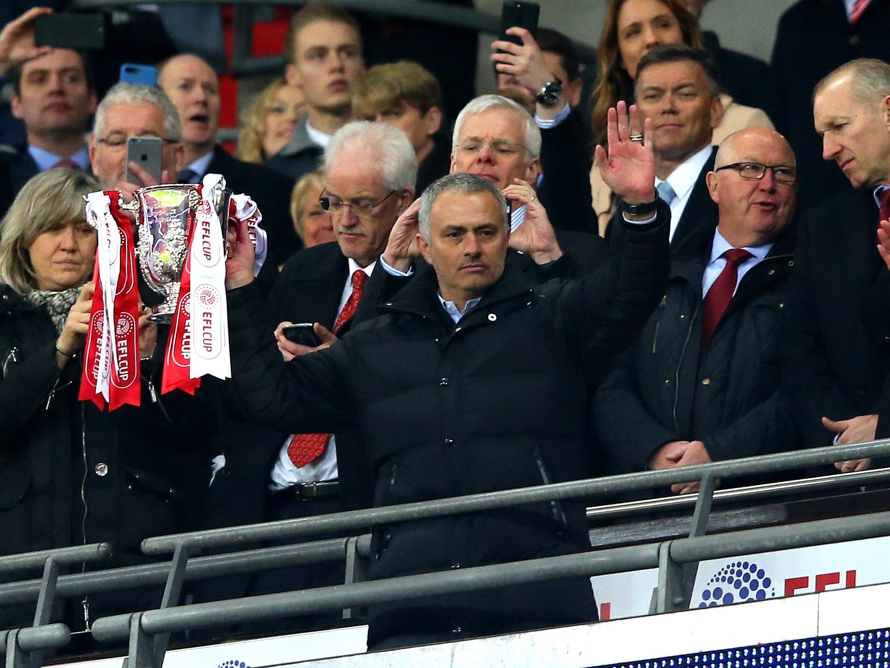 Mourinho celebrating with the EFL Cup